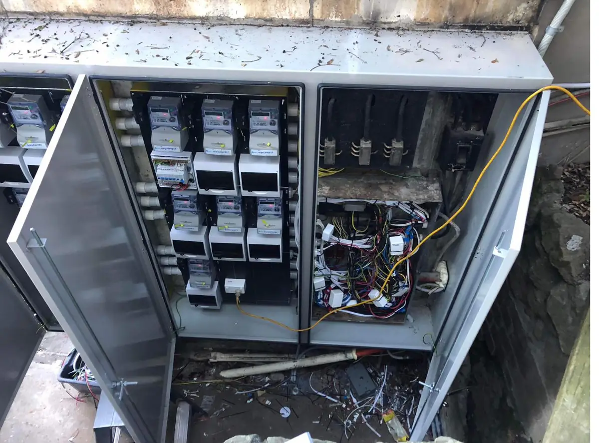 New meter enclosure opened, showing smart meters and unit distribution boards neatly installed